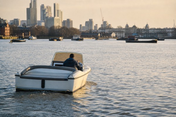 Small private boat with its own skipper on a quiet stretch of the Thames