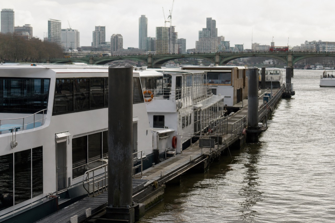 Cruise boats moored at Westminster Pier on the Thames Embankment in central London