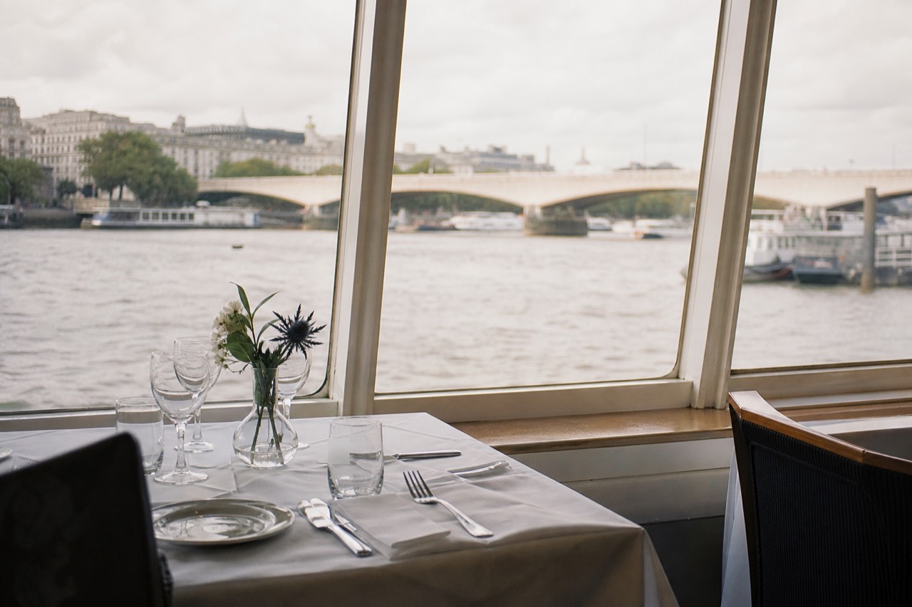 Two-course lunch plated by a window on a daytime Thames cruise